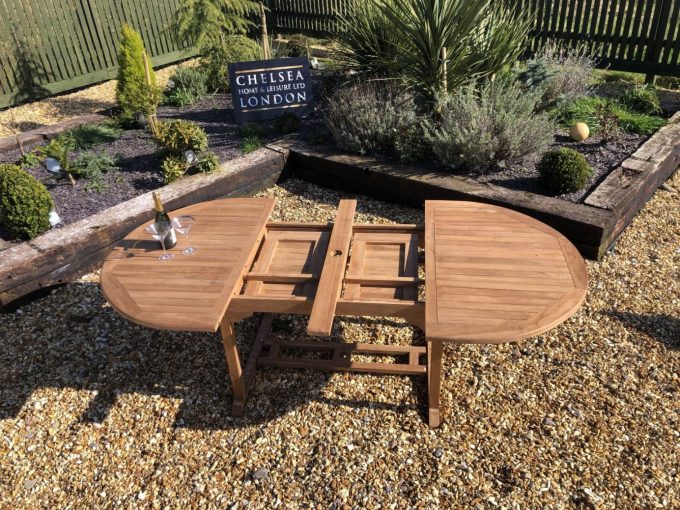 Teak extending table with 8 stacking chairs